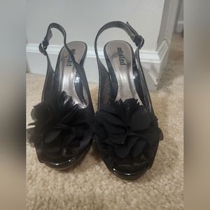 Black Heels with a flower on toes. 6.5